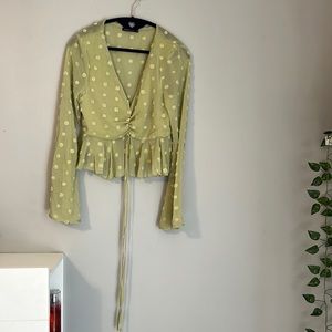 Light green polka dotted crop top.